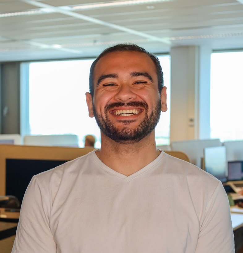 Nathan Ribeiro smiling in an office